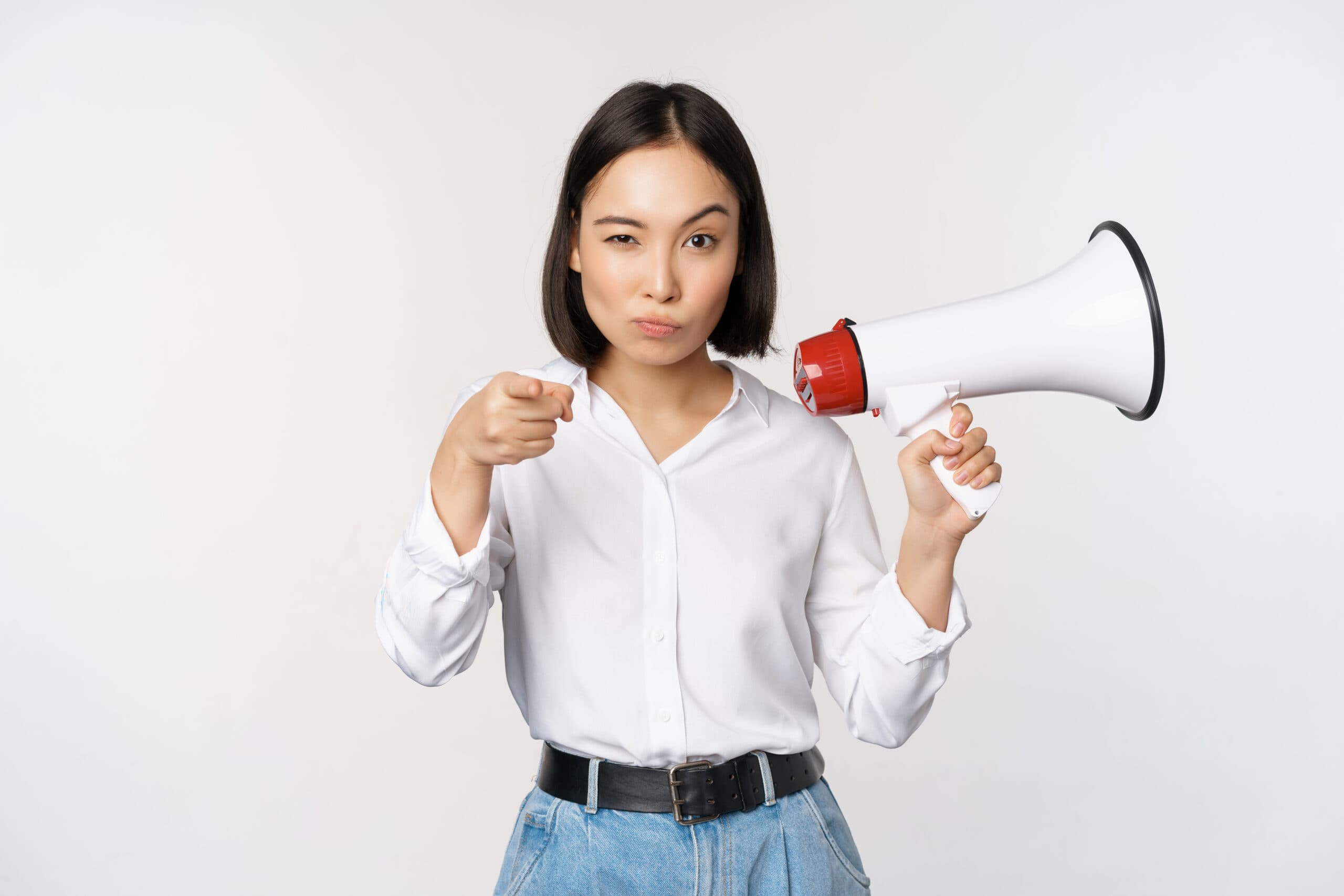 image-modern-asian-woman-with-megaphone-pointing-you-camera-making-announcement-white-background