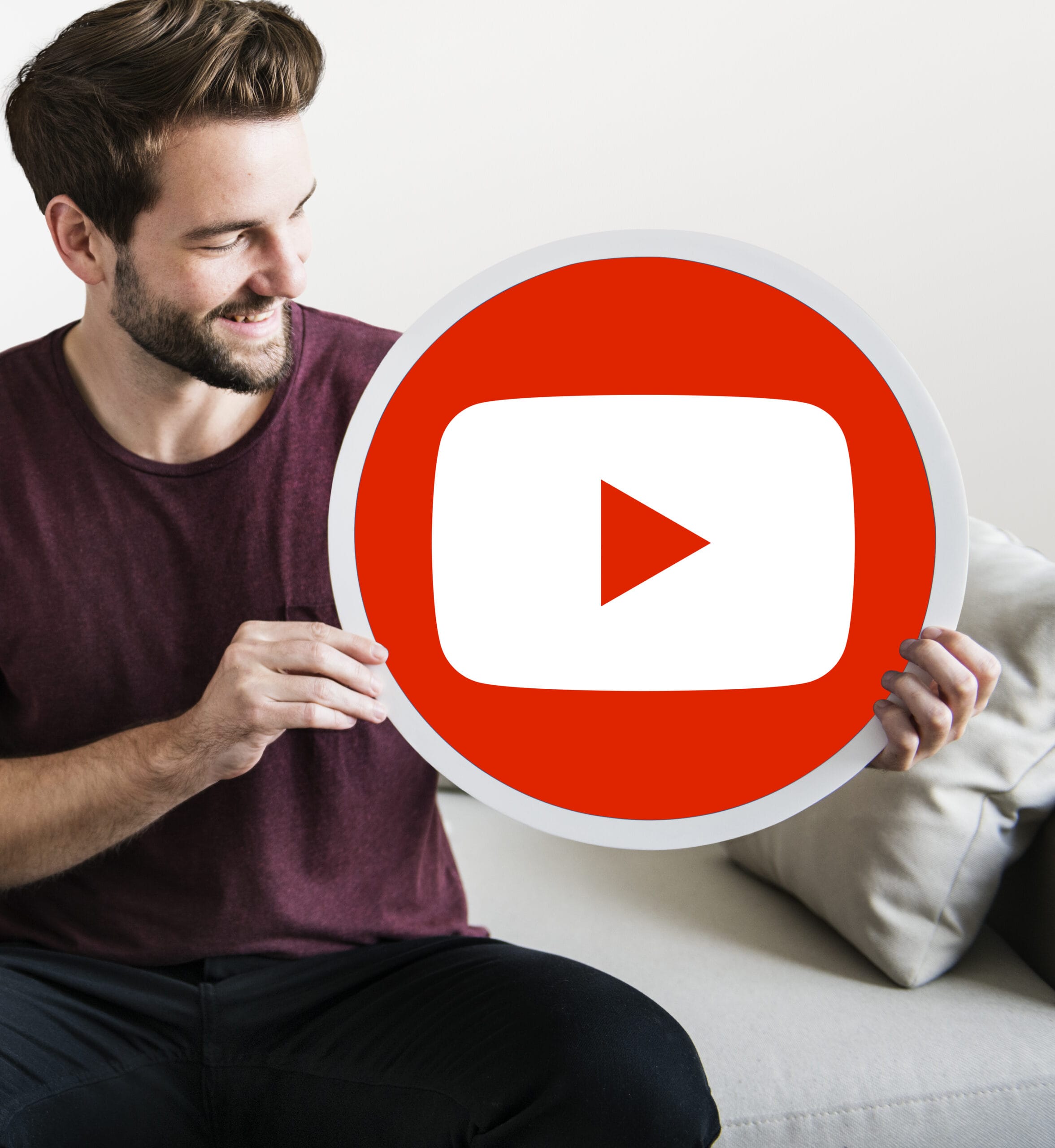 person-holding-youtube-icon-scaled