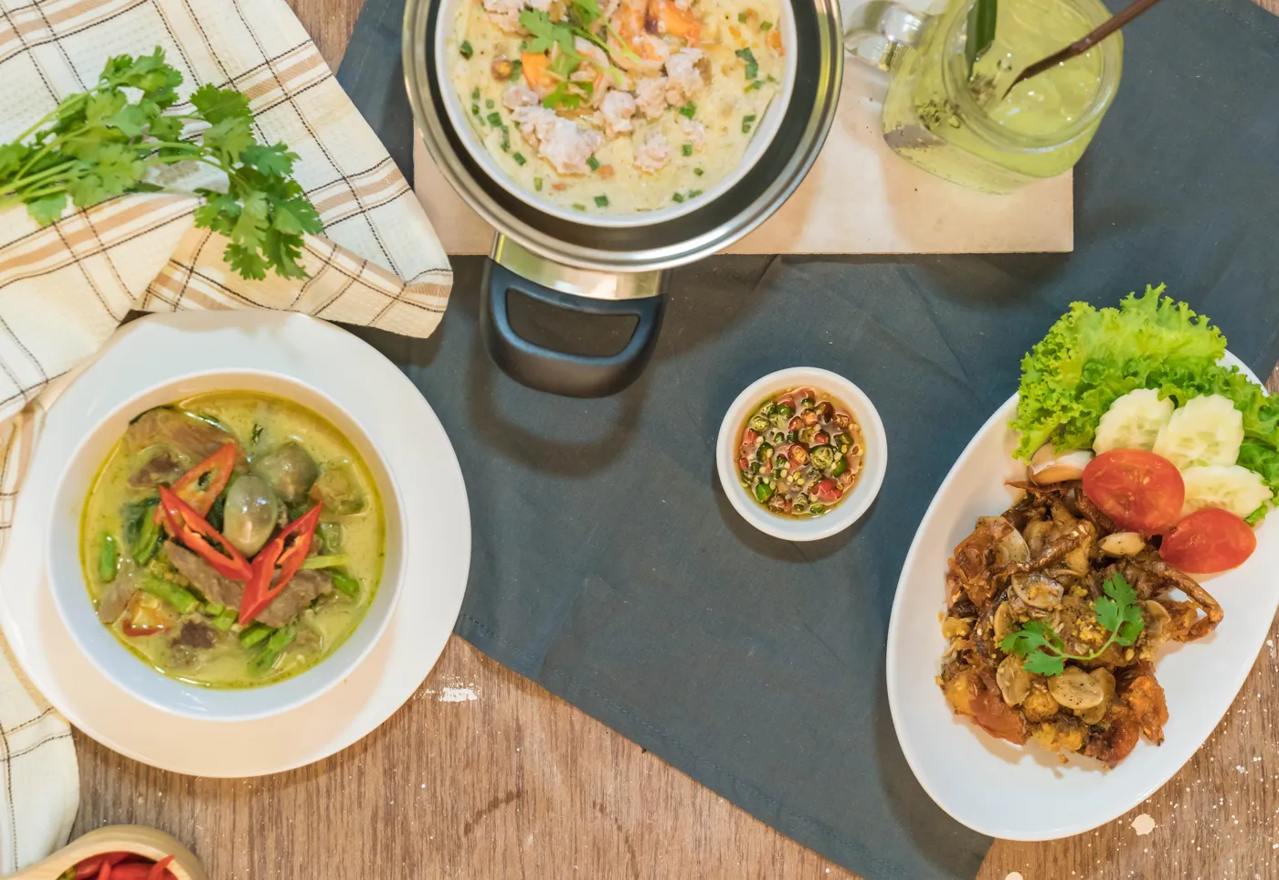A selection of Thai dishes arranged on a dining table
