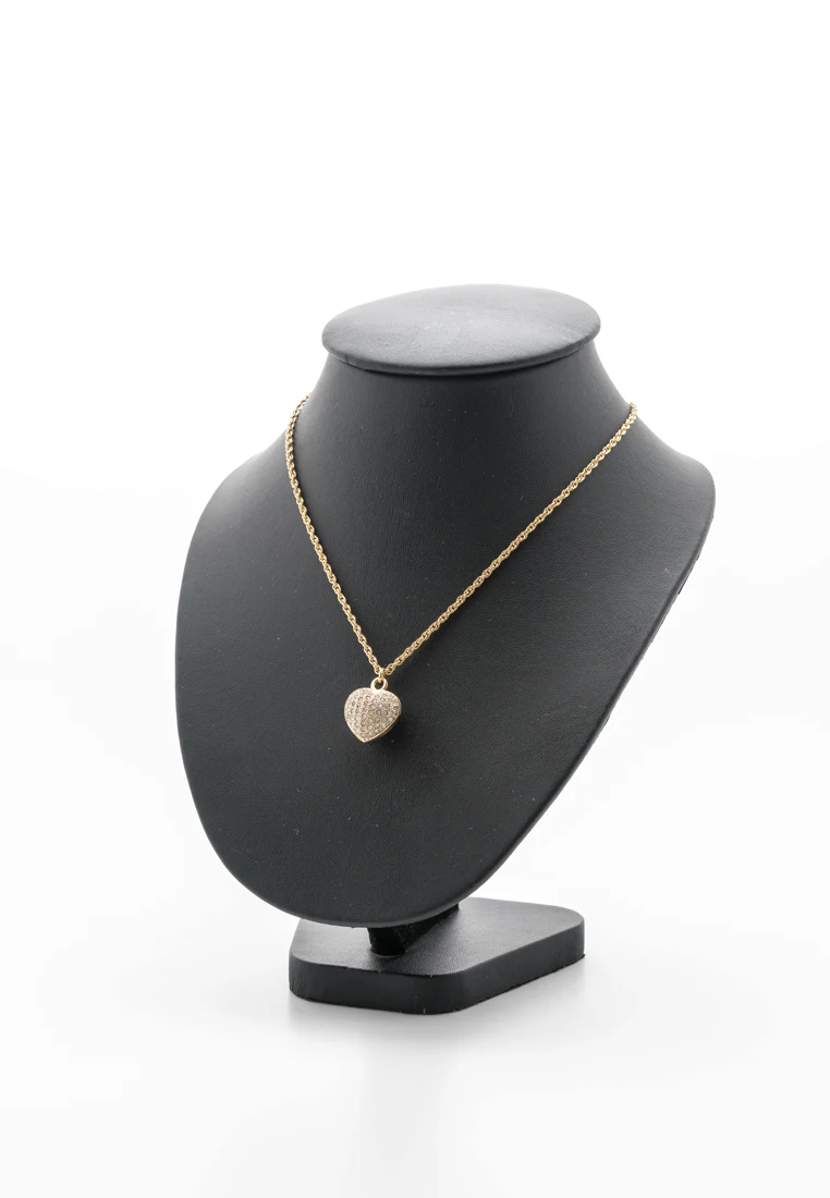 Fine gold pendant necklace displayed on a jewelry stand