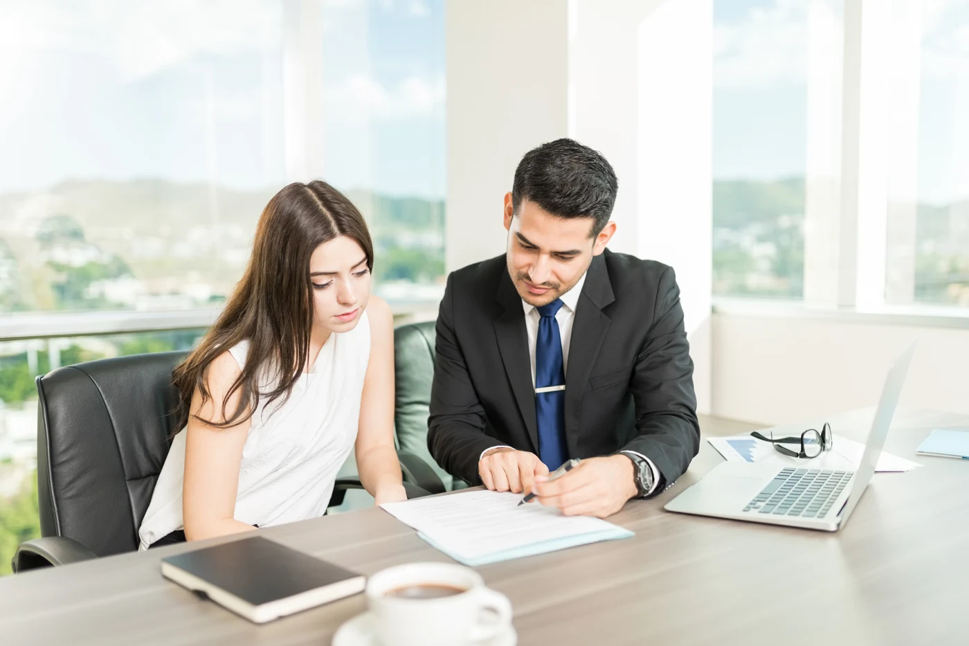 Legal adviser explaining a document during a client consultation