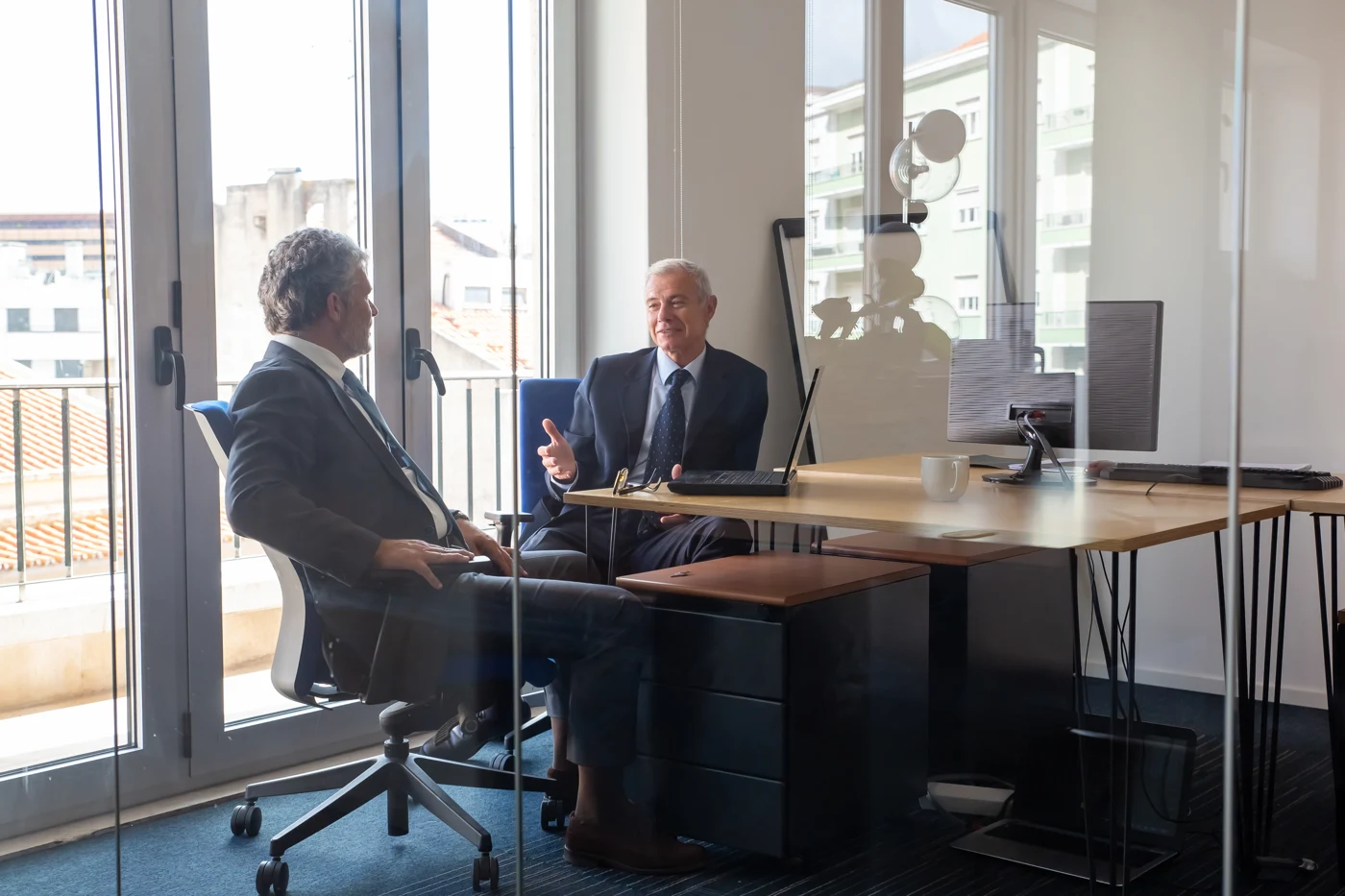 Professional advisers discussing business matters in a bright office