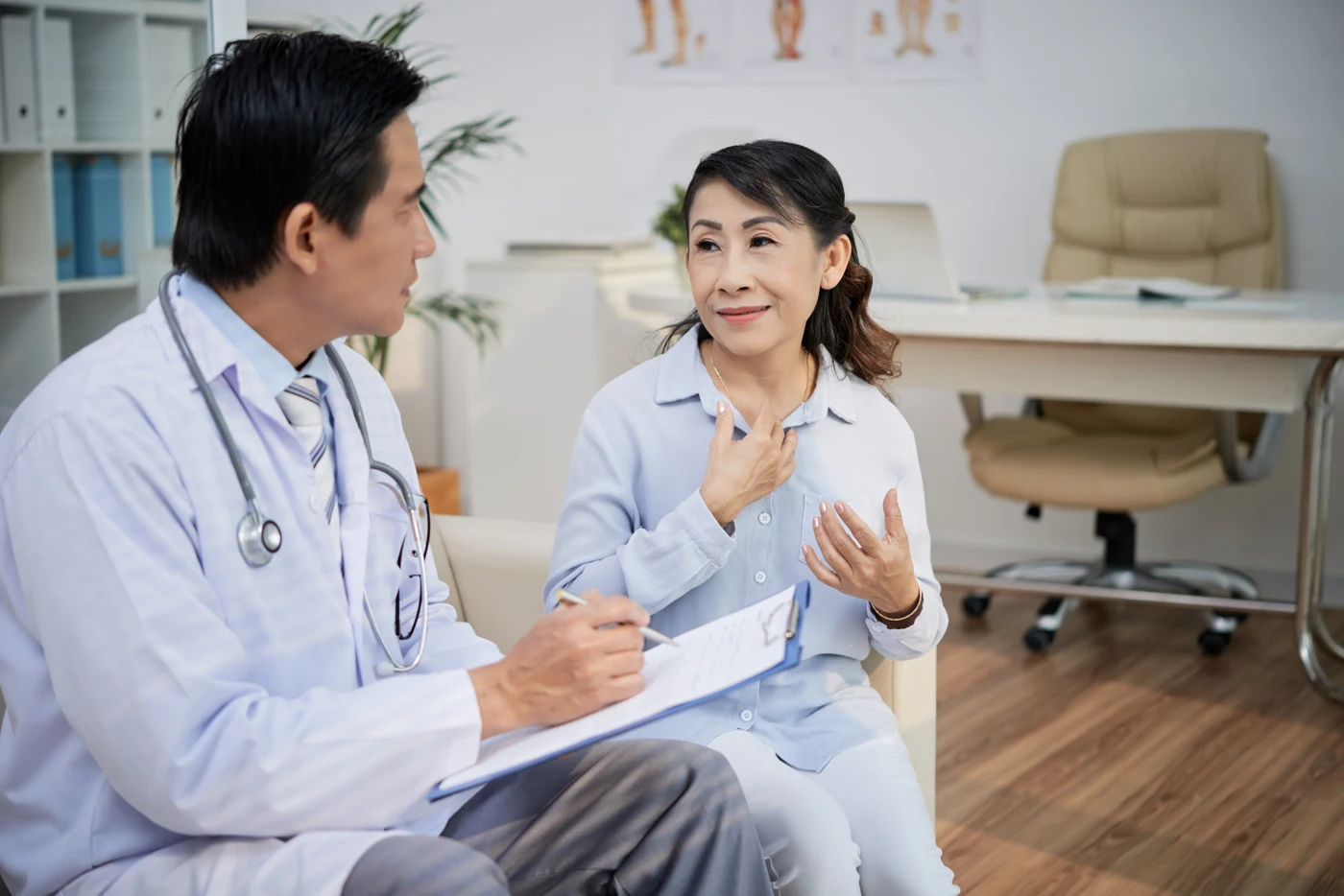 Doctor listening to a patient during a clinic consultation