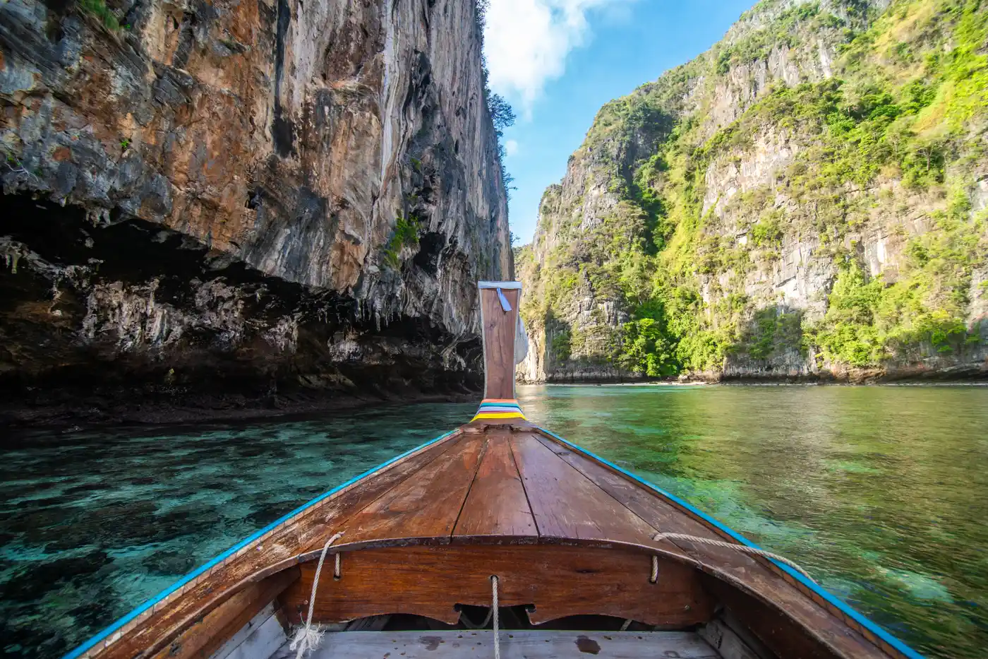 View from a traditional longtail boat between limestone cliffs in Thailand