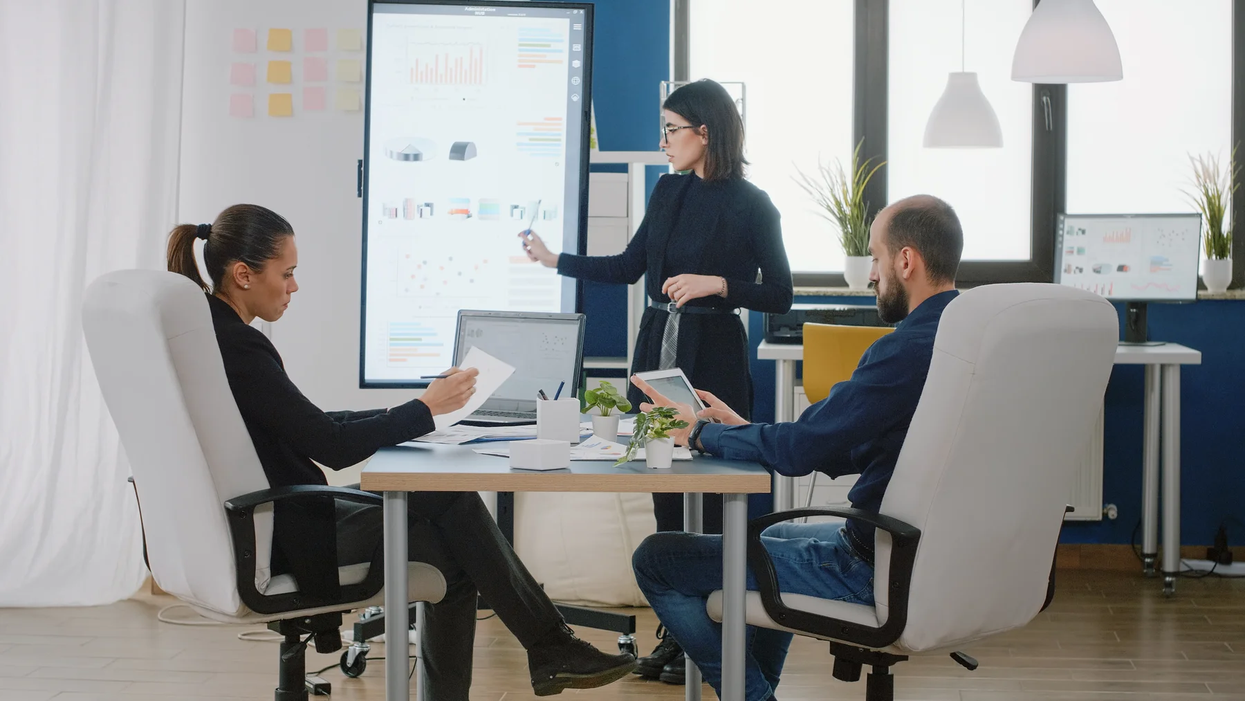 Colleagues reviewing a process and learning together in an office