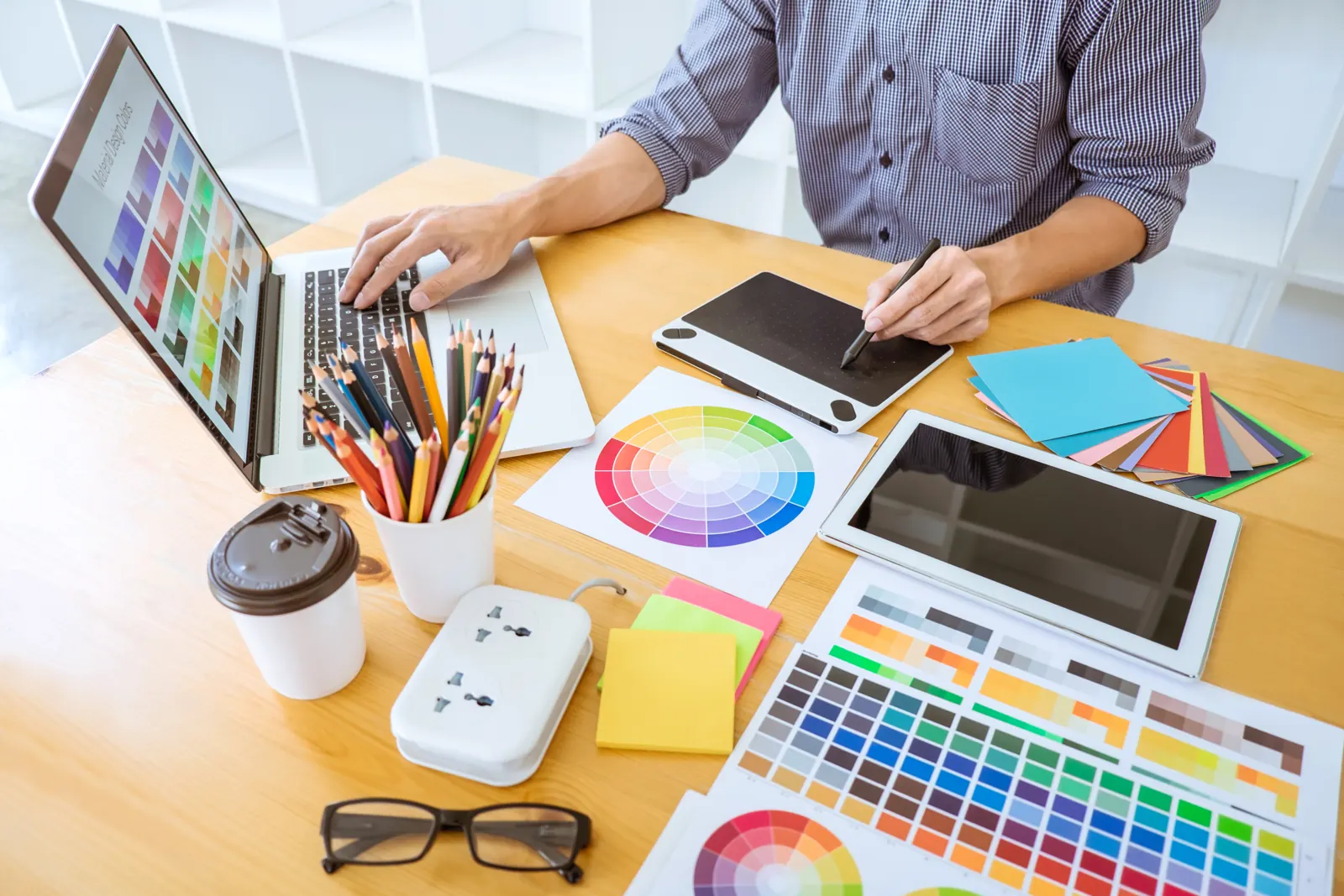 Designer working with colour palettes and digital creative